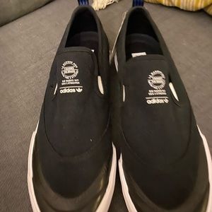 Brand new men’s size 12 Adidas slip on’s